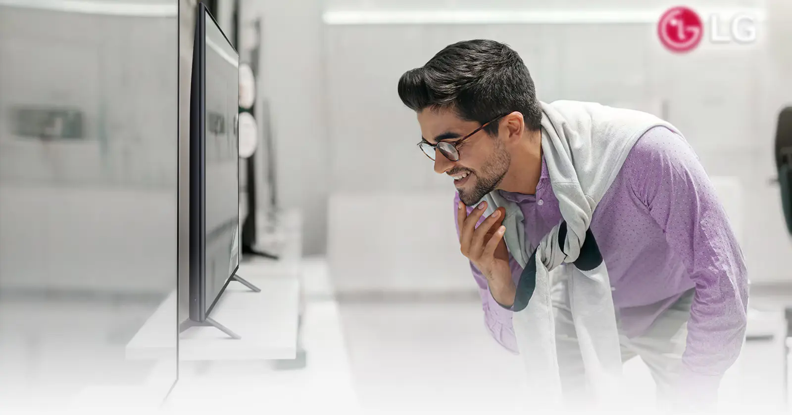 A man looking at a tv